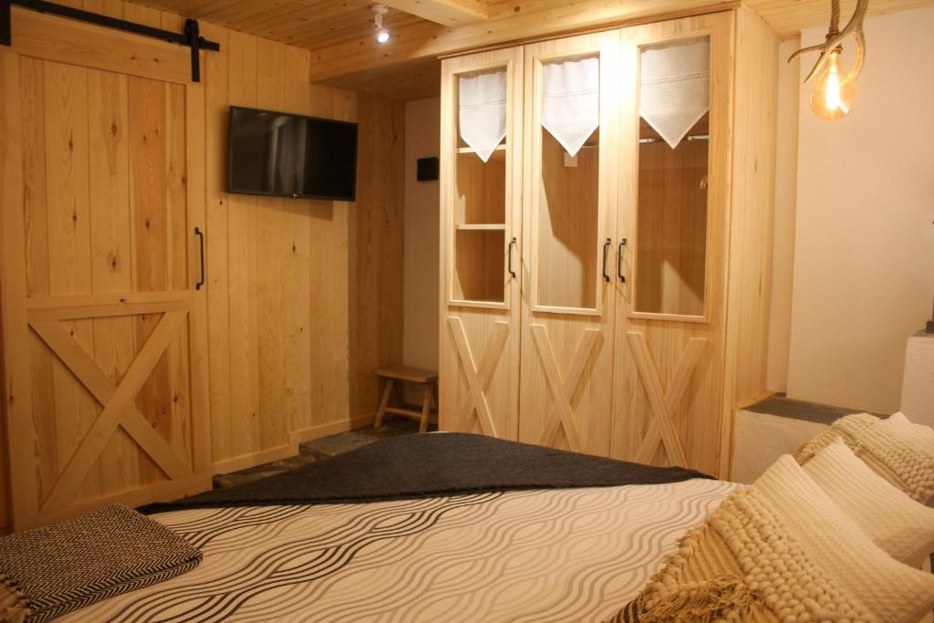 Postel nebo postele na pokoji v ubytování CASA DONDELA
