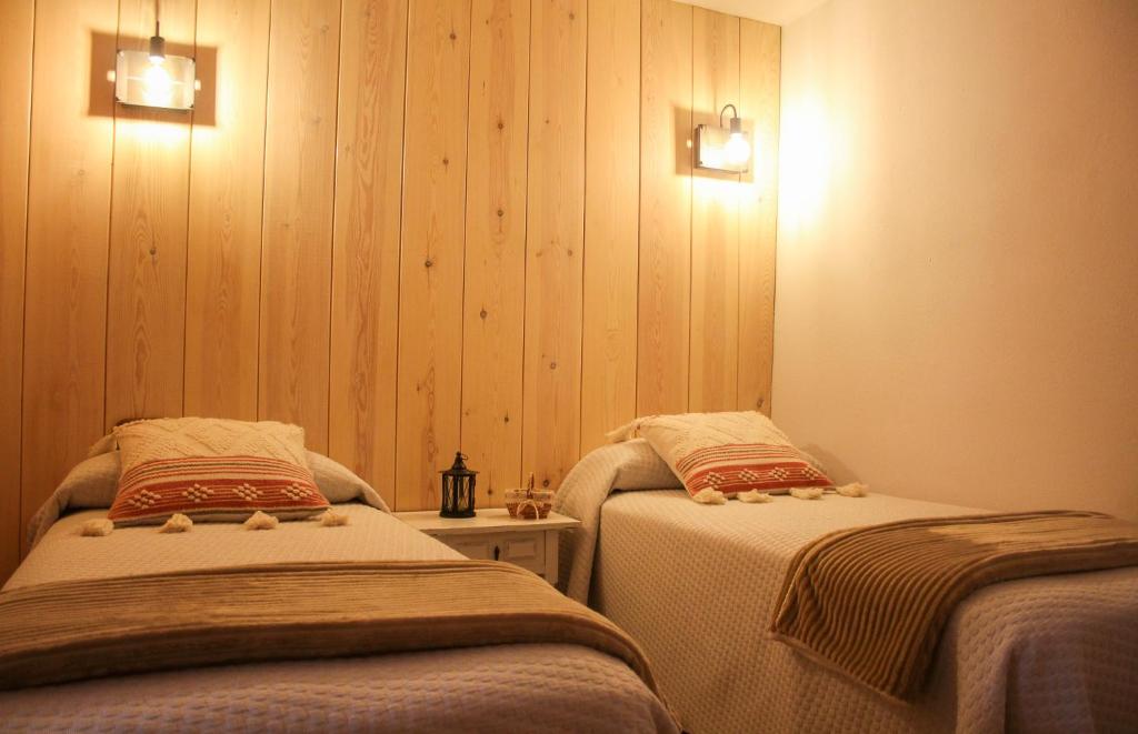 Postel nebo postele na pokoji v ubytování CASA DONDELA