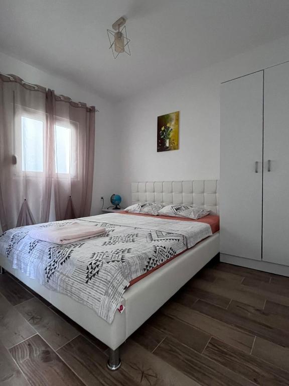 Postel nebo postele na pokoji v ubytování Apartmani Vanja