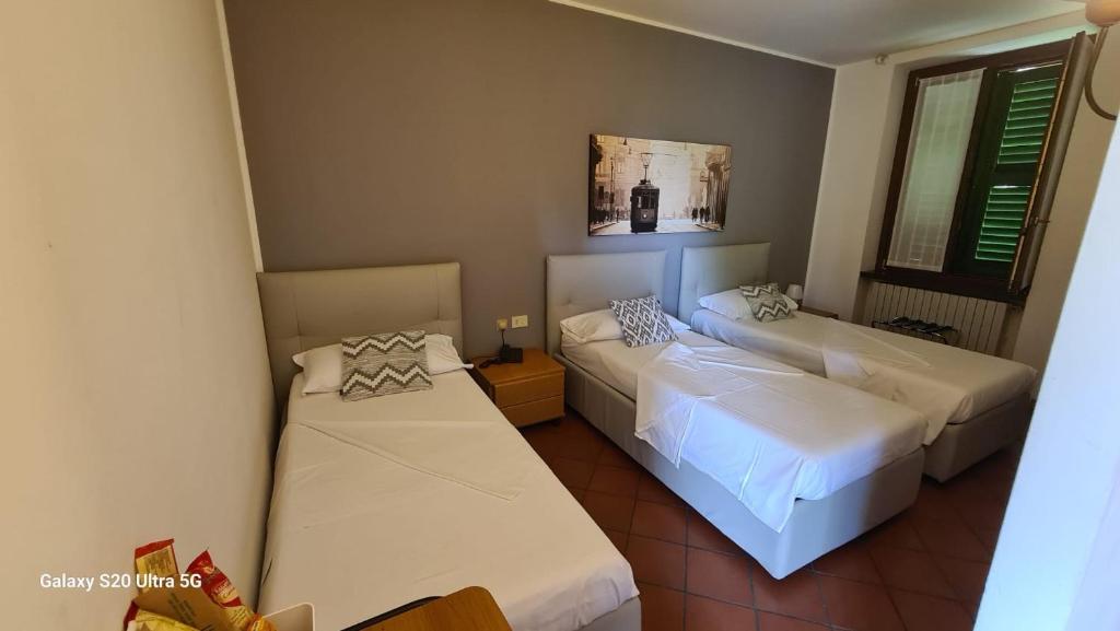 Voodi või voodid majutusasutuse ALBERGO LA SCALETTA toas
