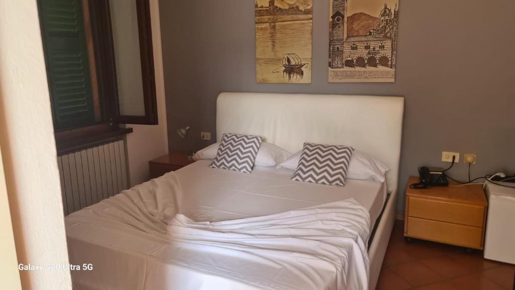 Voodi või voodid majutusasutuse ALBERGO LA SCALETTA toas