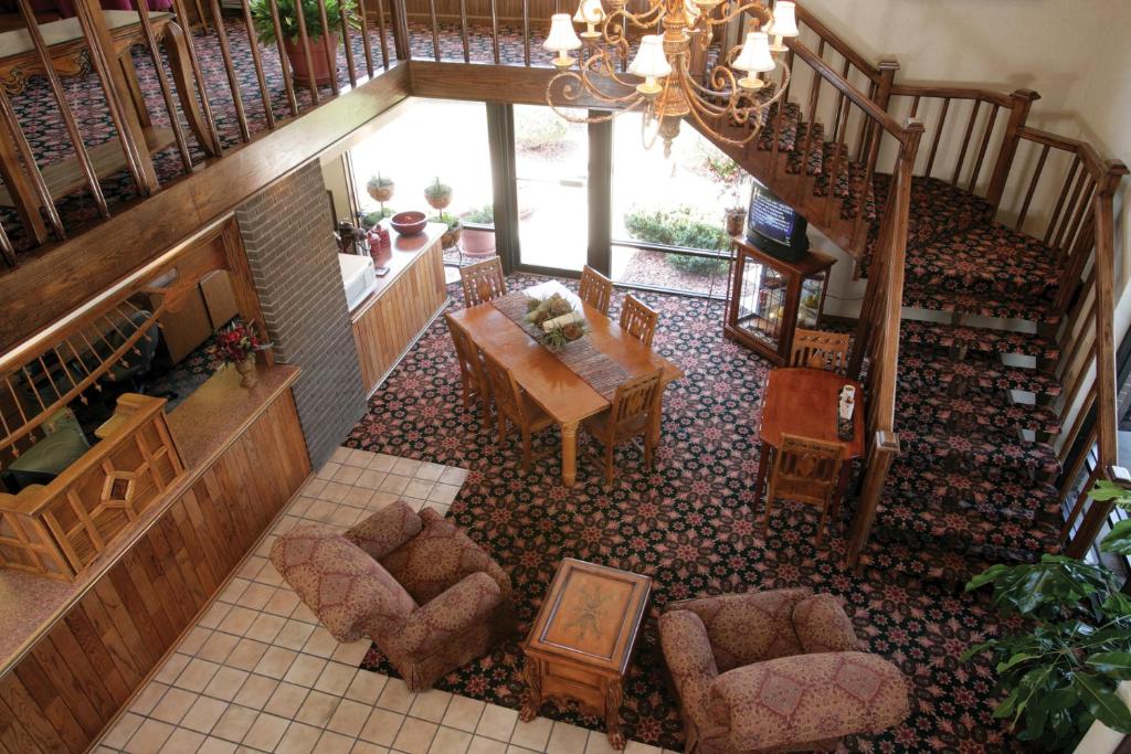 an overhead view of a living room with a table and chairs at The Foothills Inn in Rapid City