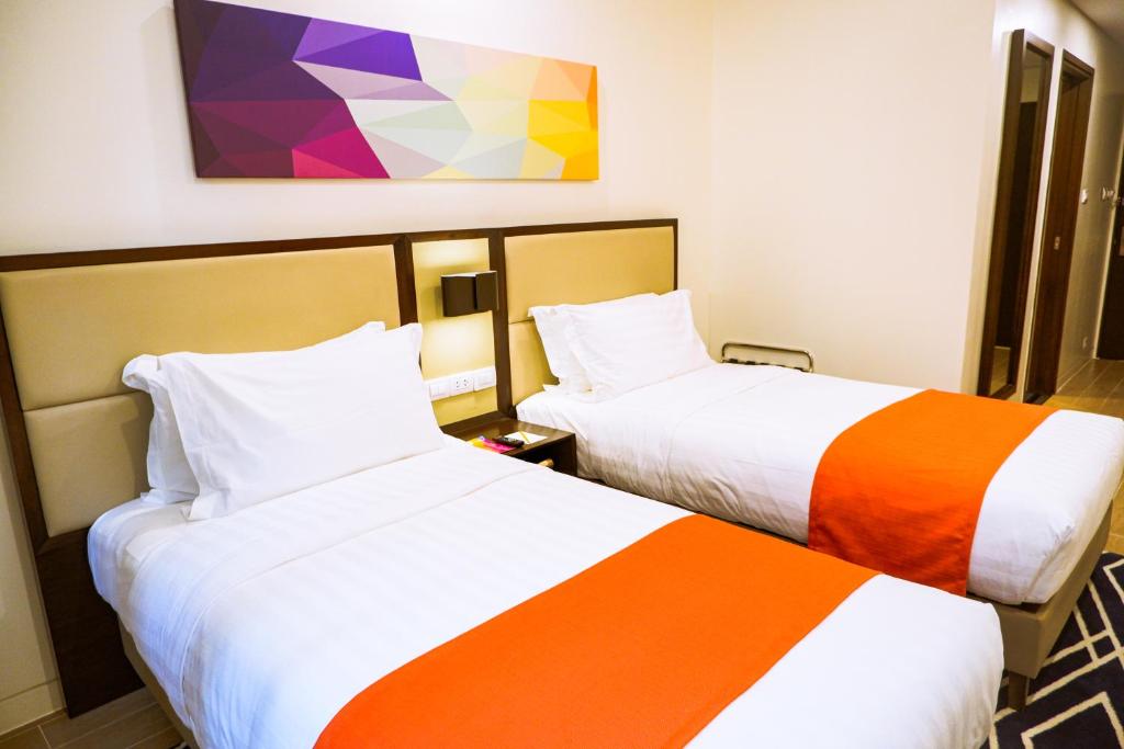 Postel nebo postele na pokoji v ubytování Hotel Lucky Chinatown Binondo