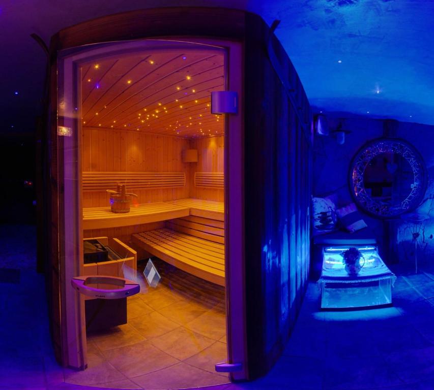 a room with a sauna with a bench in it at Logis Hôtel et Spa Le Christiania in La Salle-les-Alpes