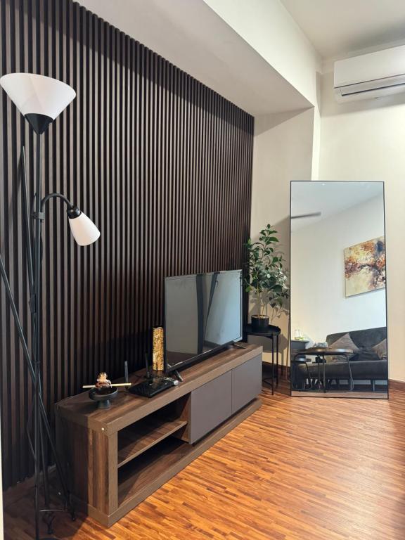 TV a/nebo společenská místnost v ubytování K Avenue by SRI Stay