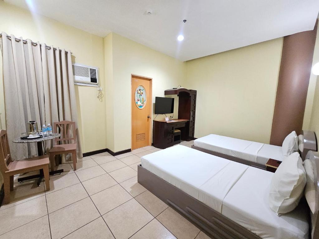 Postel nebo postele na pokoji v ubytování Hotel Nicanor