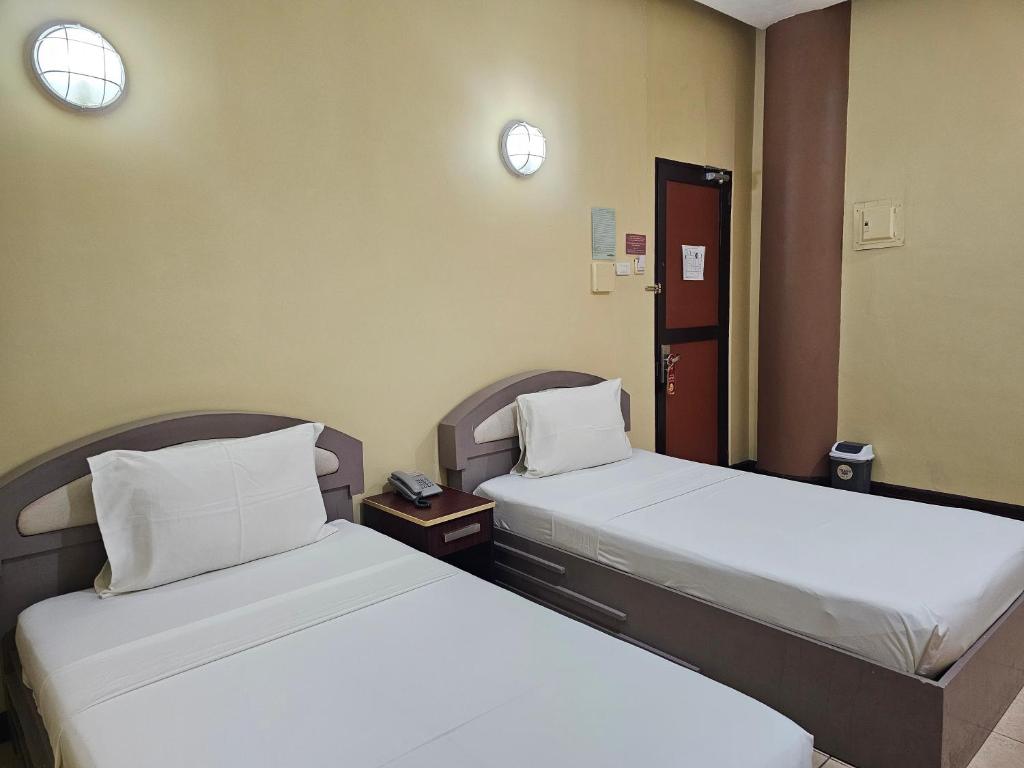 Postel nebo postele na pokoji v ubytování Hotel Nicanor