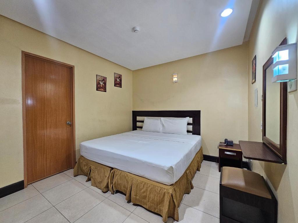 Postel nebo postele na pokoji v ubytování Hotel Nicanor