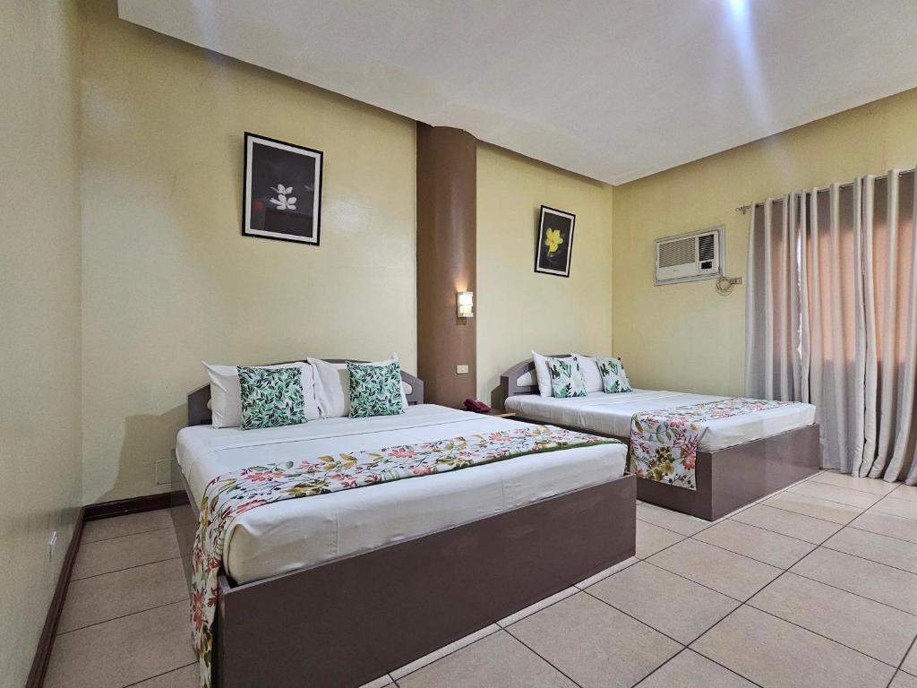 Postel nebo postele na pokoji v ubytování Hotel Nicanor
