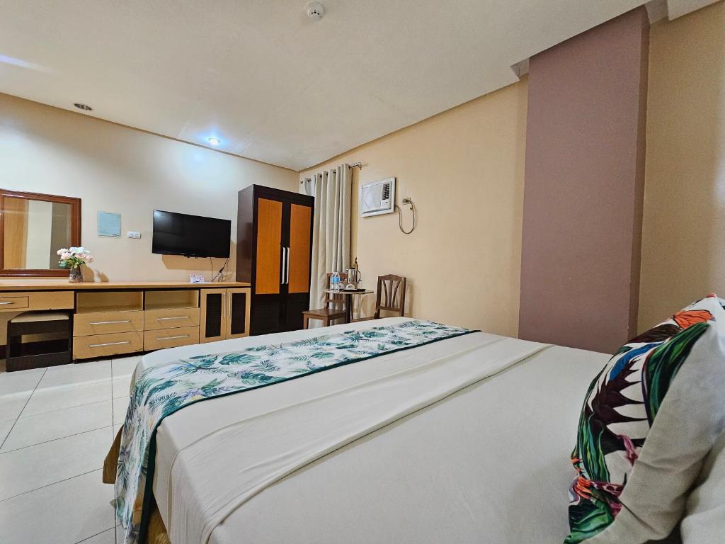Postel nebo postele na pokoji v ubytování Hotel Nicanor