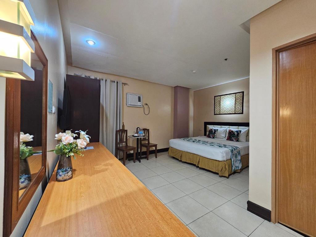 Postel nebo postele na pokoji v ubytování Hotel Nicanor