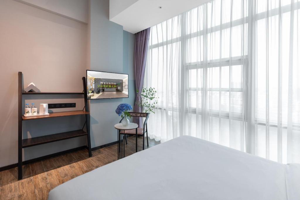 Postel nebo postele na pokoji v ubytování Spring Time Hotel