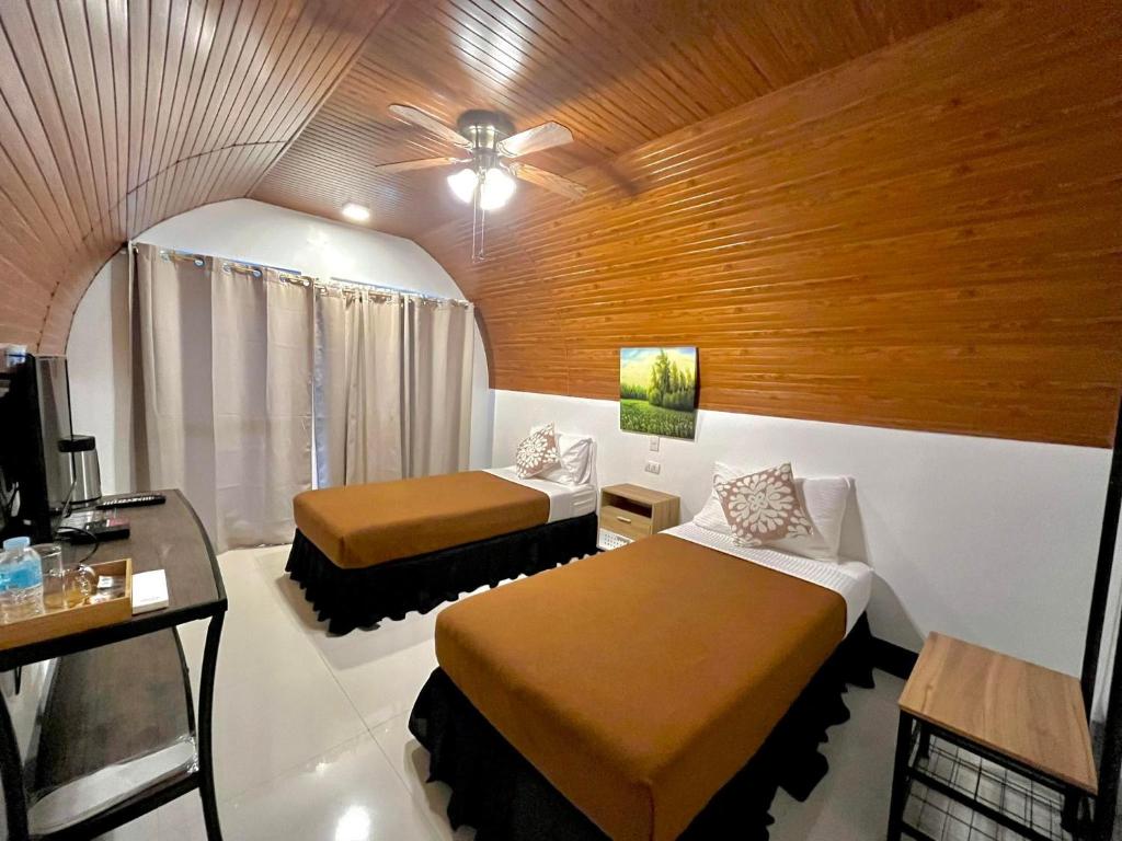 Postel nebo postele na pokoji v ubytování Montefrio Garden Resort