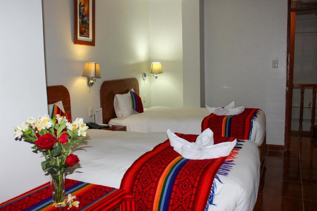 Postel nebo postele na pokoji v ubytování Hotel Wiracocha Machupicchu