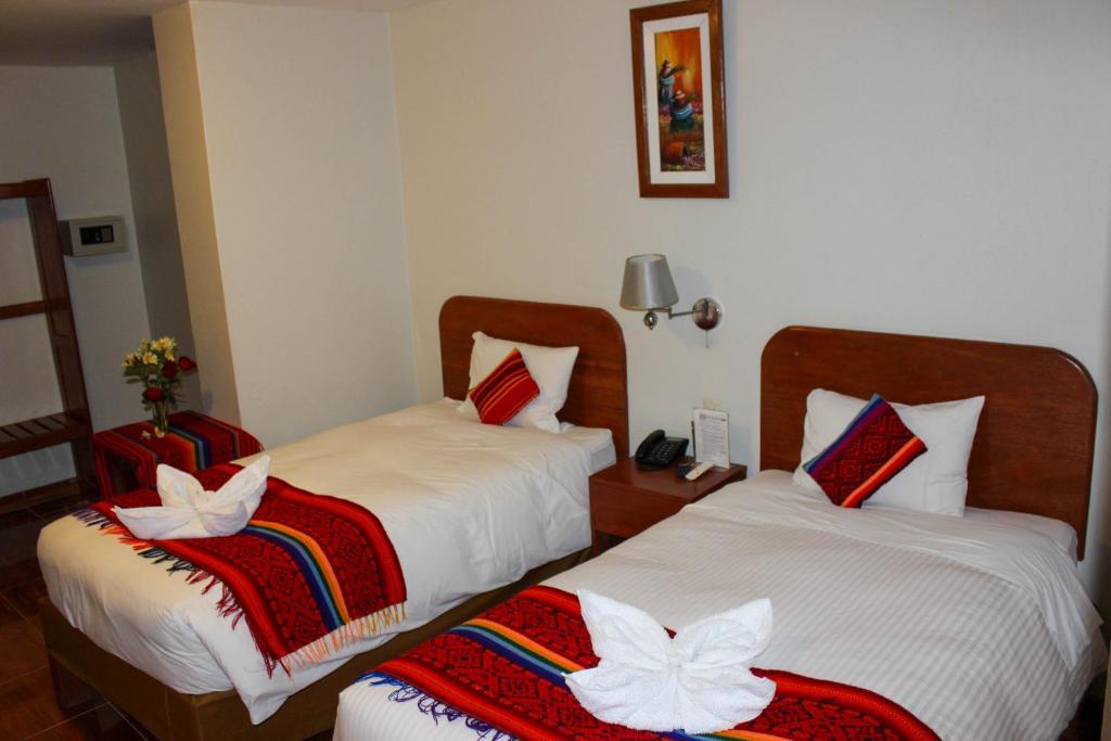 Postel nebo postele na pokoji v ubytování Hotel Wiracocha Machupicchu