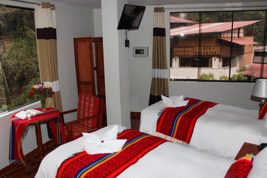 Postel nebo postele na pokoji v ubytování Hotel Wiracocha Machupicchu