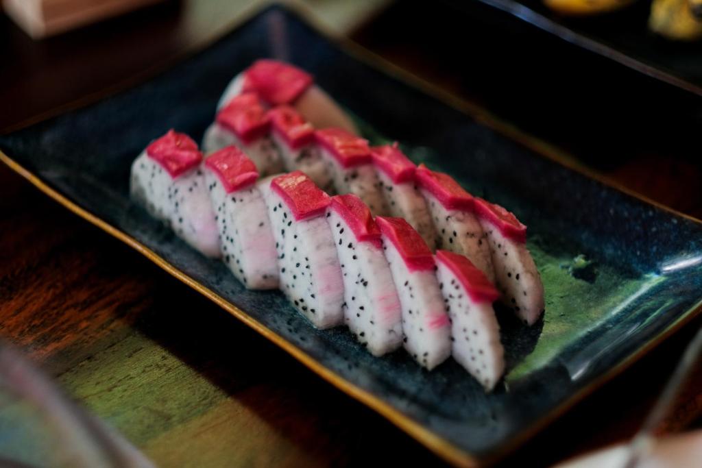 a plate of sushi on top of a table at Trang An Ecolodge in Ninh Binh