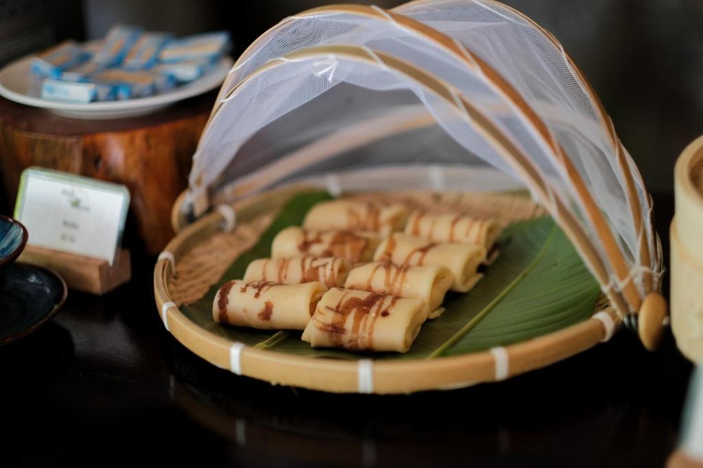 a basket of food sitting on a table at Trang An Ecolodge in Ninh Binh