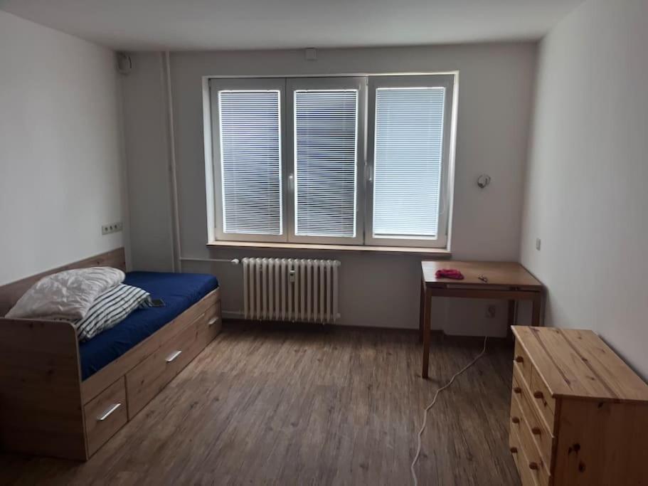Postel nebo postele na pokoji v ubytování 3kk - centrum Havířova