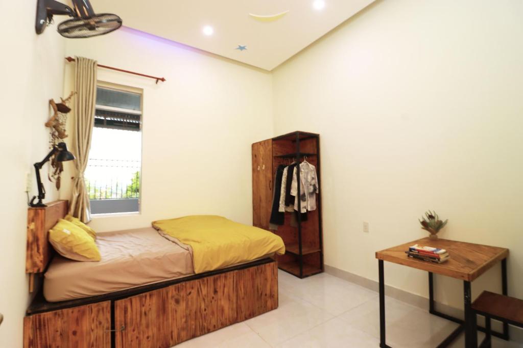 Postel nebo postele na pokoji v ubytování Thỏ Non Garden Bảo Lộc Corner 01