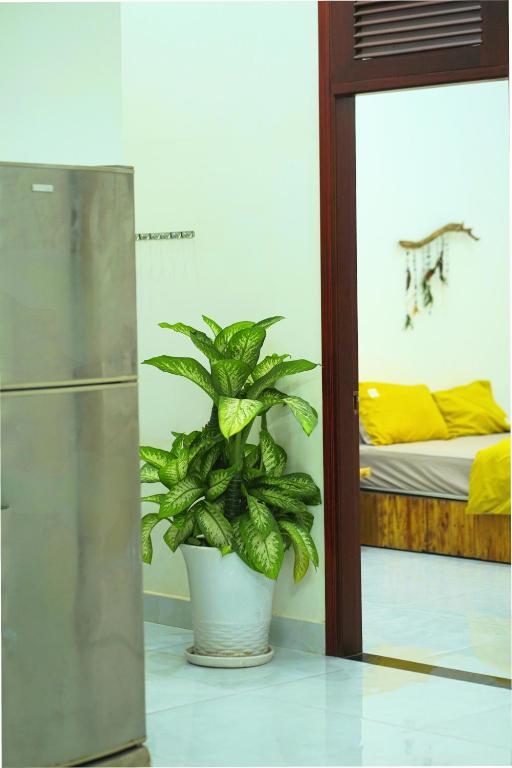 Postel nebo postele na pokoji v ubytování Thỏ Non Garden Bảo Lộc Corner 01