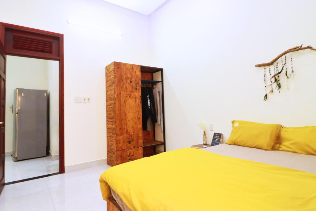 Postel nebo postele na pokoji v ubytování Thỏ Non Garden Bảo Lộc Corner 01