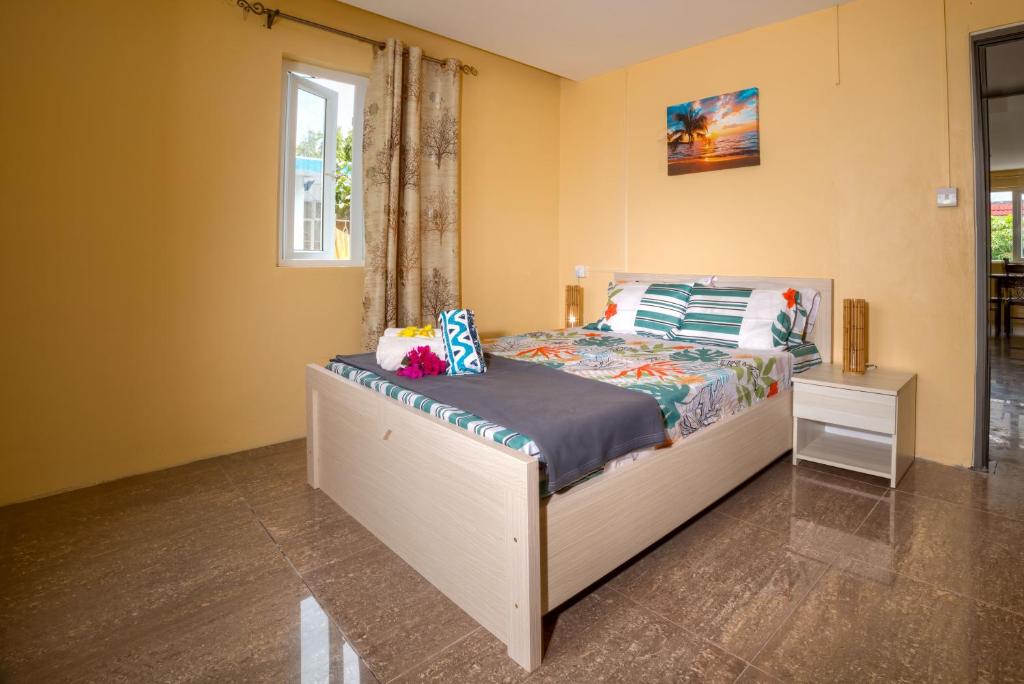 Postel nebo postele na pokoji v ubytování Sunset Bliss Pereybere 3