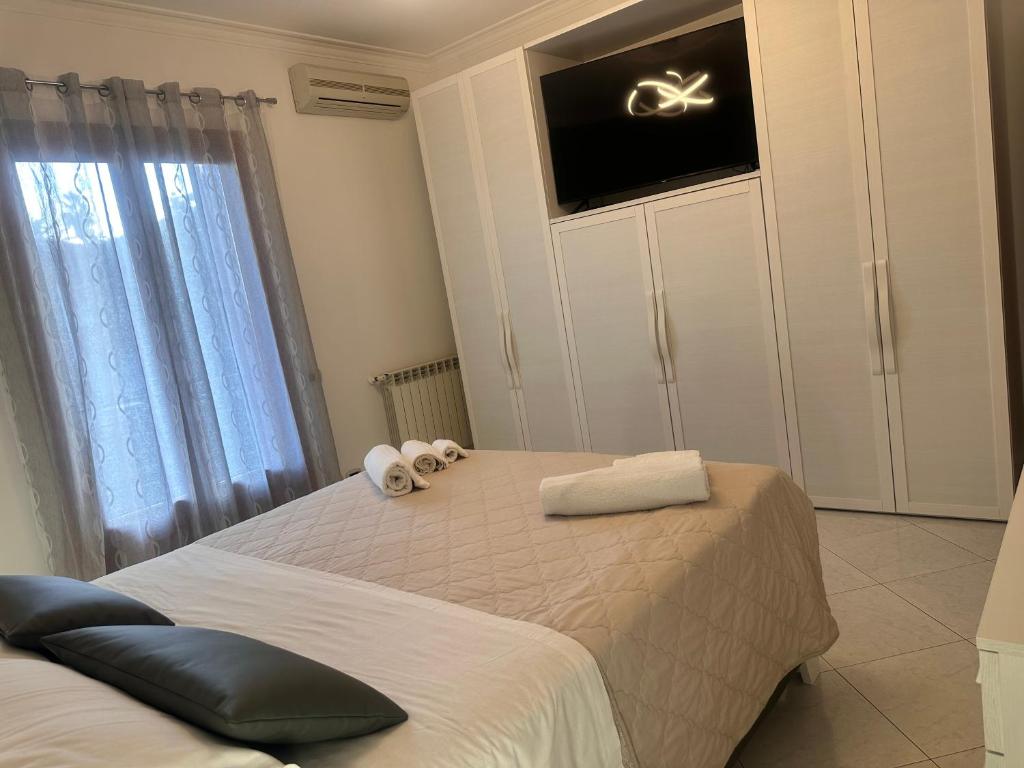 Łóżko lub łóżka w pokoju w obiekcie Etna holiday