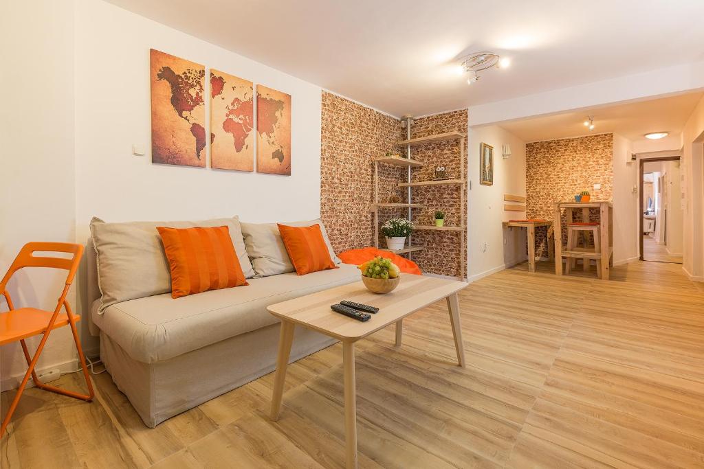 a living room with a couch and a table at Stylish apartment, Top center! in Sofia