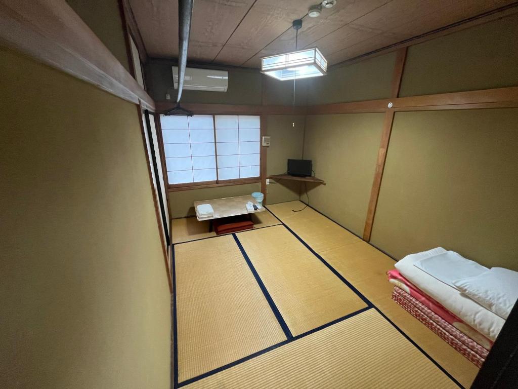 Postel nebo postele na pokoji v ubytování ふる里 Mt Fuji Inn Furusato