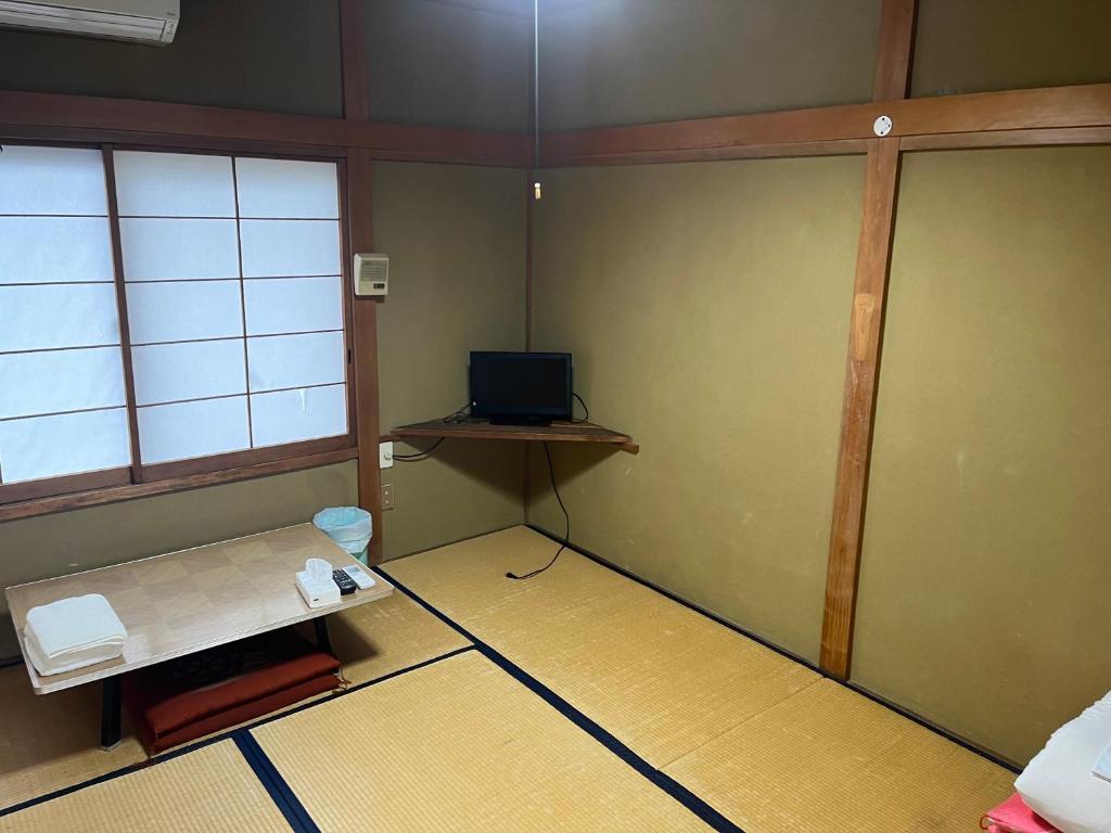 Postel nebo postele na pokoji v ubytování ふる里 Mt Fuji Inn Furusato
