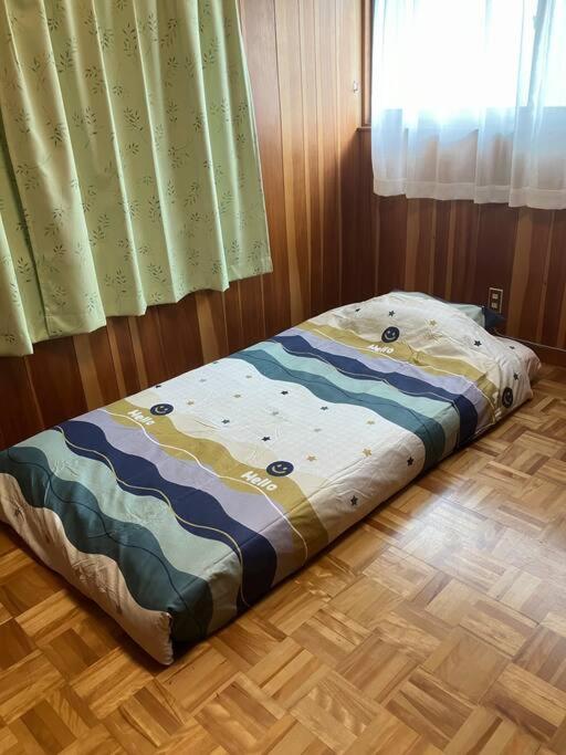 Postel nebo postele na pokoji v ubytování いわしの子守唄 Sardine Lullaby