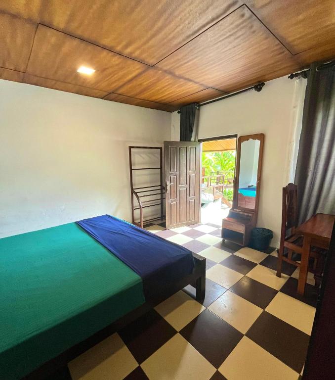 Postel nebo postele na pokoji v ubytování Maccan's Village