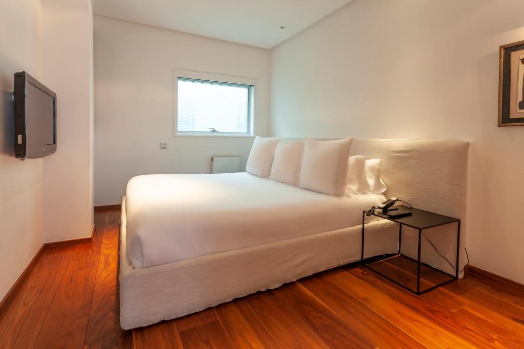Postel nebo postele na pokoji v ubytování Suites Avenue