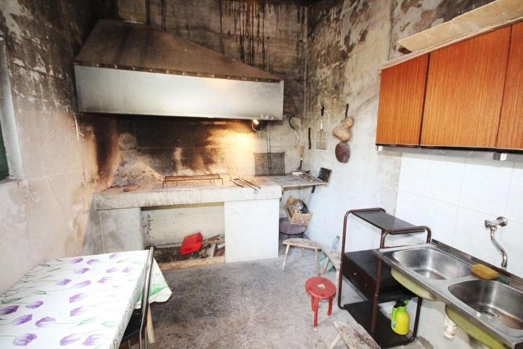 Kuchyň nebo kuchyňský kout v ubytování Apartments JoviZe