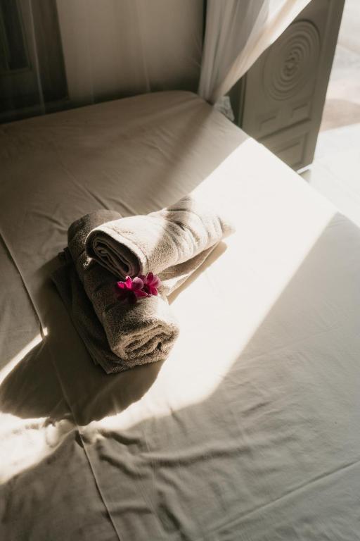 Postel nebo postele na pokoji v ubytování HAWARA CoLiving Midigama