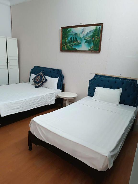 Postel nebo postele na pokoji v ubytování Hanoi Carina Hotel