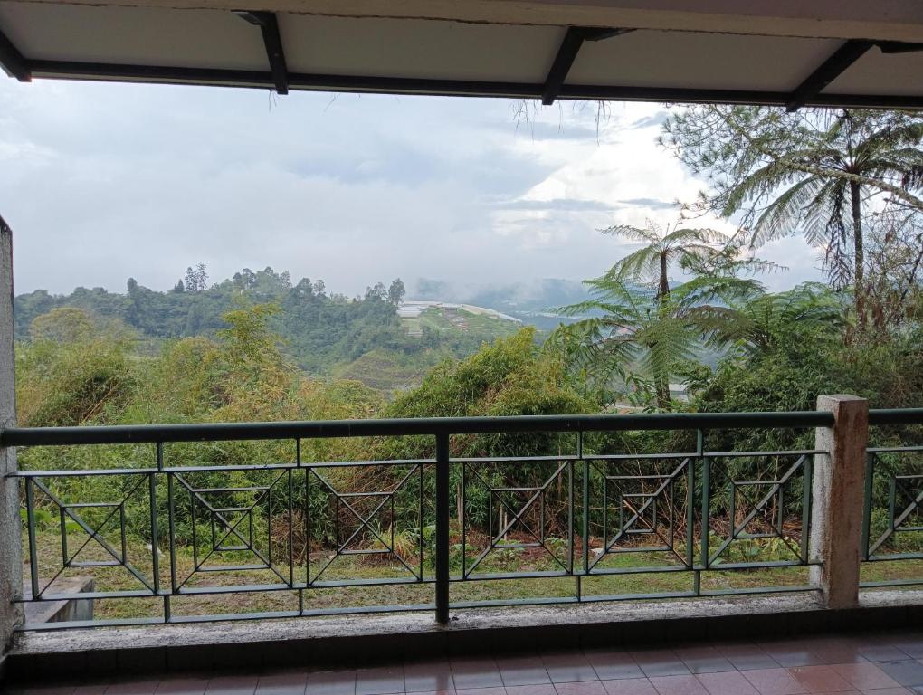 a view from the balcony of a house at Cozy Nest 1 Bedroom Apartment at Equatorial Hill Resort in Brinchang