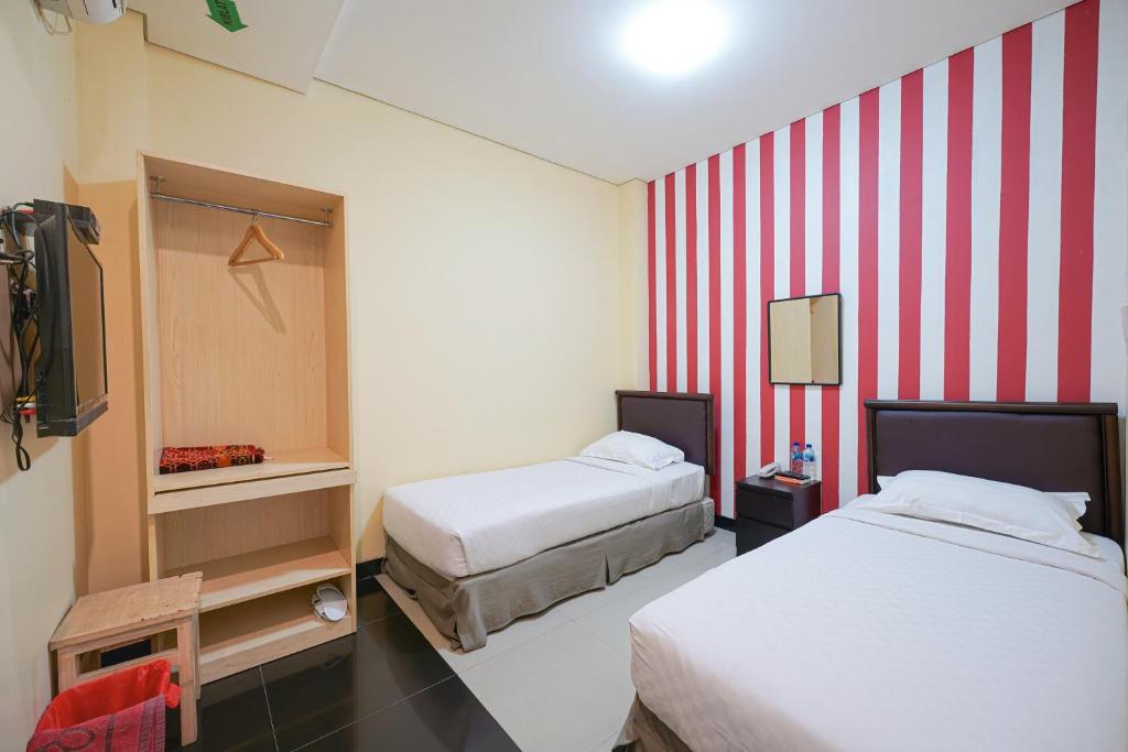 Letto o letti in una camera di Multi 88 Syariah