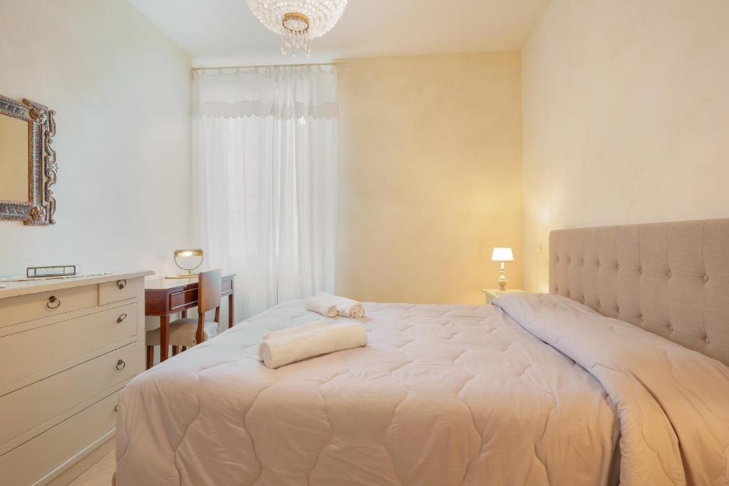 Łóżko lub łóżka w pokoju w obiekcie Guasto Apartment