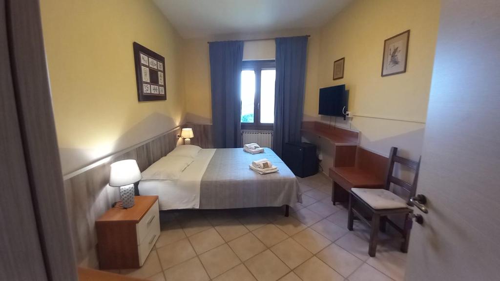Postel nebo postele na pokoji v ubytování Hotel Le 3 Fonti