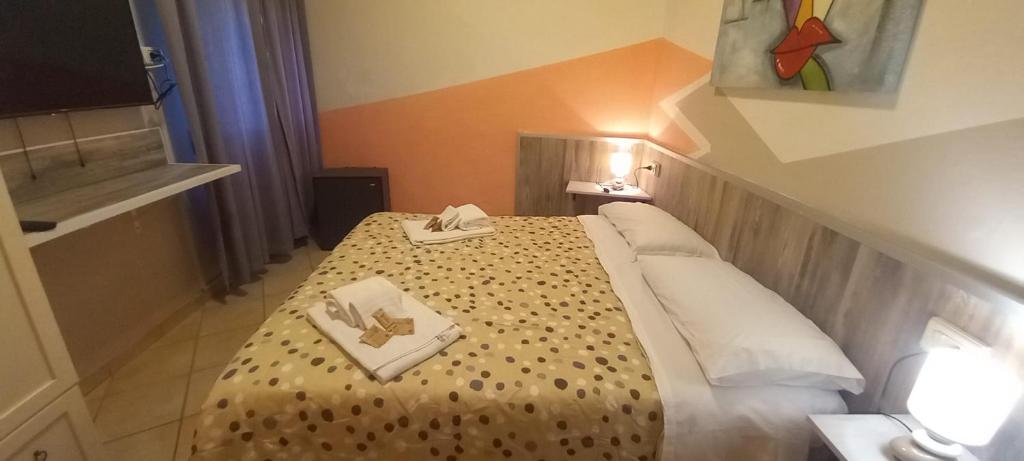 Postel nebo postele na pokoji v ubytování Hotel Le 3 Fonti