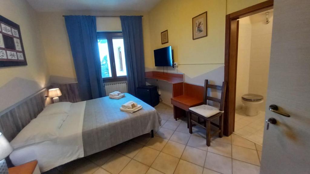 Postel nebo postele na pokoji v ubytování Hotel Le 3 Fonti