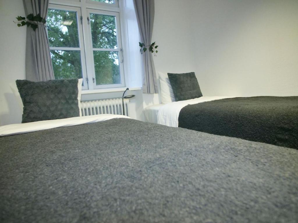 Voodi või voodid majutusasutuse Svaleholm Gaard Roskilde toas