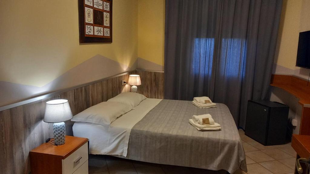 Postel nebo postele na pokoji v ubytování Hotel Le 3 Fonti