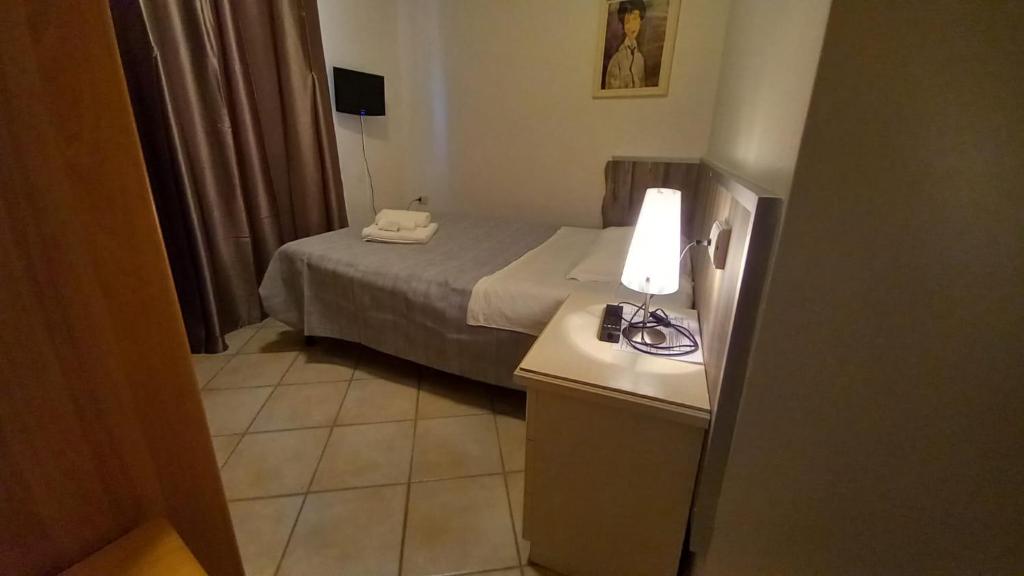 Postel nebo postele na pokoji v ubytování Hotel Le 3 Fonti