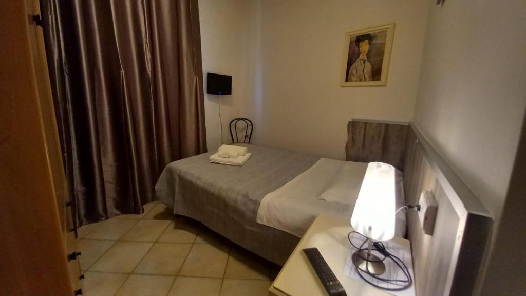 Postel nebo postele na pokoji v ubytování Hotel Le 3 Fonti