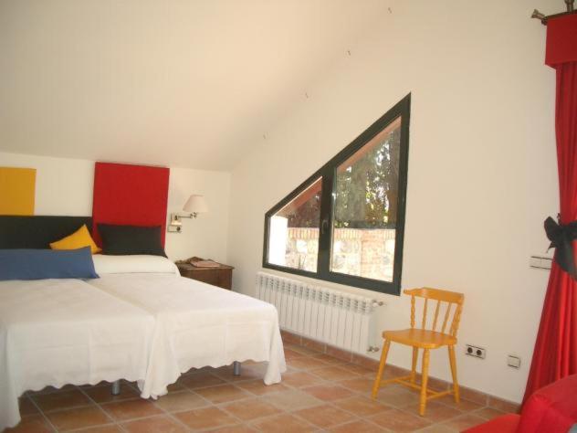 A bed or beds in a room at Casa Rural 3 en un fantástico legado