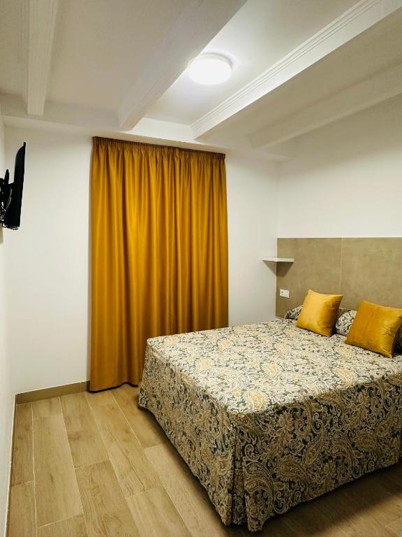 Postel nebo postele na pokoji v ubytování Hotel Quitagolpe