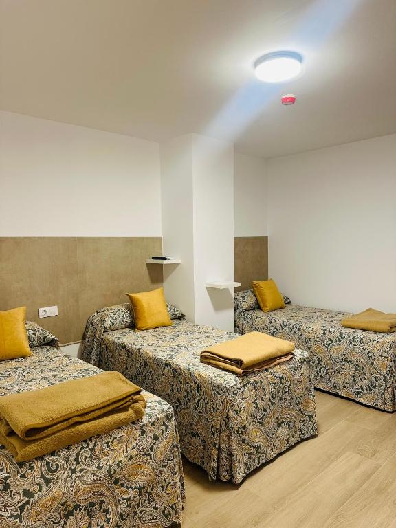 Postel nebo postele na pokoji v ubytování Hotel Quitagolpe